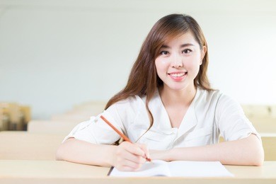 young beautiful asian girl student in classroom
