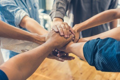 business people making pile of hands , soft focus, vintage tone
