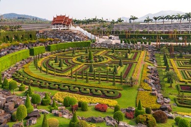 nong nooch tropical garden in pattaya, thailand. panorama landscape view of formal garden.