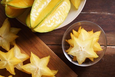 star fruit, starfruit, carambola on wooden background