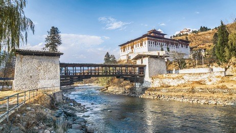 the bridge across the river with traditional bhutan palace, paro rinpung dzong, bhutan