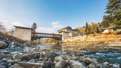 the bridge across the river with traditional bhutan palace, paro rinpung dzong, bhutan