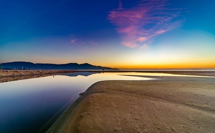 my khe beach is a beautiful beach in danang city ,  vietnam.  the sunrise was reflected in the pond bond before the beach. my khe beach is in  top 6 beautiful beach in the world by forbes magazine.  