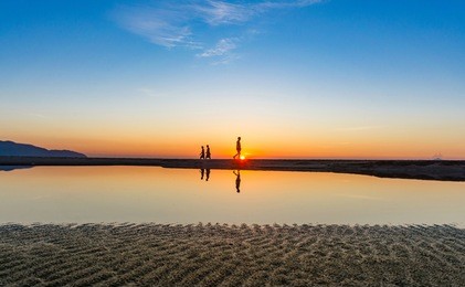 my khe beach is a beautiful beach in danang city ,  vietnam.  the sunrise was reflected in the pond bond before the beach. my khe beach is in  top 6 beautiful beach in the world by forbes magazine.  