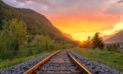 railroad tracks in the setting sun