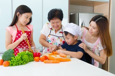 asian three generations family enjoyed cooking in the kitchen