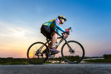 athlete cycling on the road