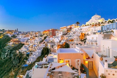 fira, modern capital of the greek aegean island, santorini, with orthodox metropolitan cathedral, during twilight blue hour, greece