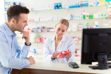 pharmacist and client at pharmacy
