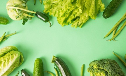 image of fresh green vegetables on green background