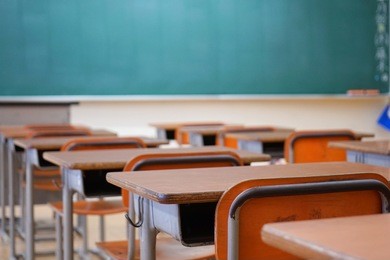 school classroom with blackboard and desks at japanese high school