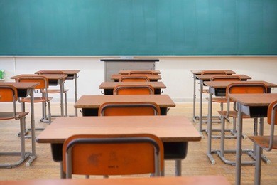 school classroom with blackboard and desks at japanese high school