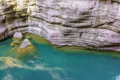 the yuntaishan geo park xiuwu county, jiaozuo, henan province of china. the view displays the rocks formations with turquoise pond and waterfall along the narrow canyon.  