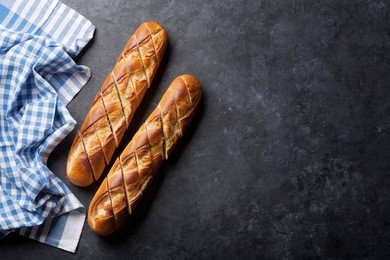 loaf of sliced bread over stone table. top view with copy space