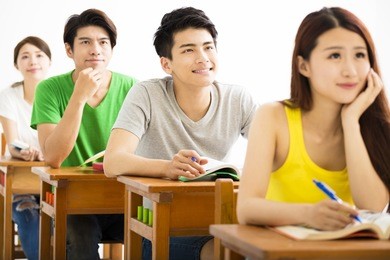 young college student group sitting in a classroom