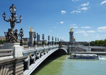 the alexander iii bridge across seine river in paris, france.