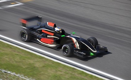  formula 2.0  race car racing at high speed on speed track with motion blur