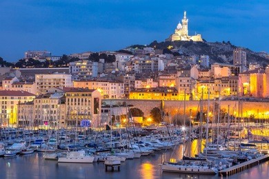 marseille, france at night. the famous european harbour view on the notre dame de la garde