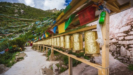 prayer wheels near the upper temple in chimpu caves, tibet, china