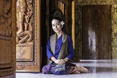 beautiful woman in native dress (silk necklace dakhmak) in thailand.
