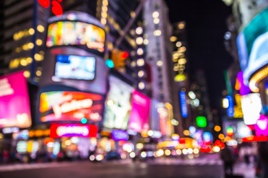 new york city defocused blur of times square lit up at night