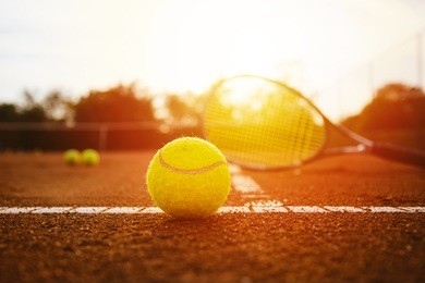 tennis equipment on clay court