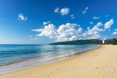 beautiful sea view on karon beach, phuket, thailand, asia. famous karon beach landscape, phuket. sunny beach. beautiful white sand sea shore and calm sea in phuket, thailand. endless sandy coastline. 