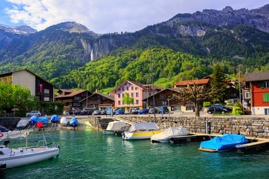 small swiss town on lake brienz near interlaken surrounded by alps mountains, switzerland