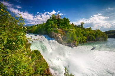 view to rhine falls (rheinfalls), the largest plain waterfall in europe. it is located near schaffhausen, between the cantons of schaffhausen and zurich