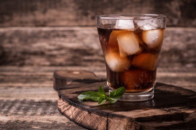 cold drink with ice on wooden vintage table