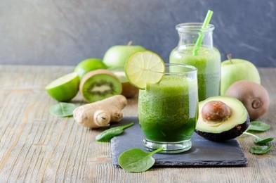 green fresh detox vegan smoothie, healthy beverage, vitamins diet drink with spinach, avocado, lime, ginger, kiwi, apple. morning organic drinking