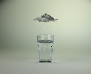 raincloud over glass of water photo manipulation/raining into glass of water