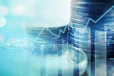 double exposure of city and graph on rows of coins for finance and banking concept