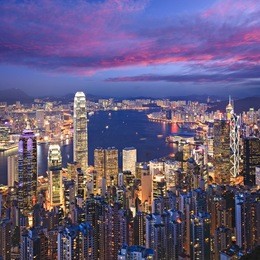 hong kong skyline illuminated at twilight, square format.
