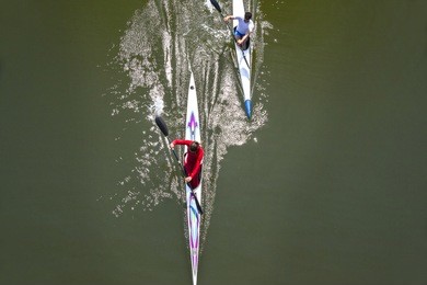 rowing race between man and woman. gender equality