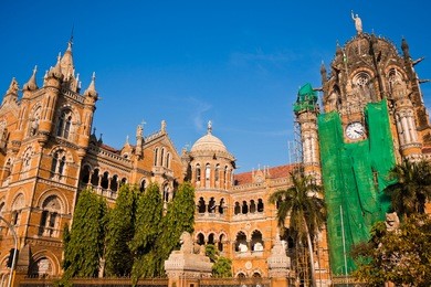 famous victoria terminus train station in mumbai, india.