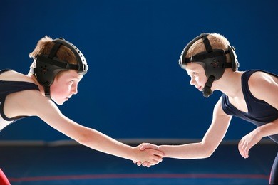 youth wrestling partners shaking hands
