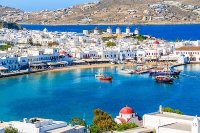 a view of mykonos port with boats, cyclades islands, greece