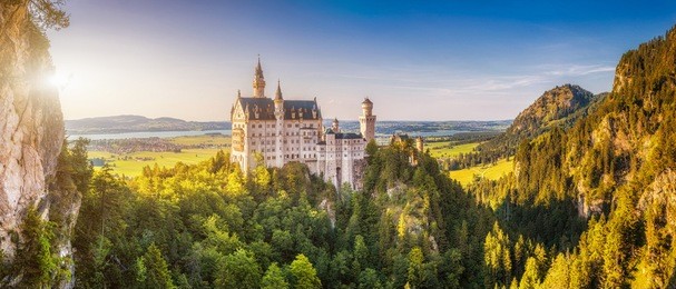 beautiful view of world-famous neuschwanstein castle, the 19th century romanesque revival palace built for king ludwig ii, in beautiful evening light at sunset, fussen, southwest bavaria, germany
