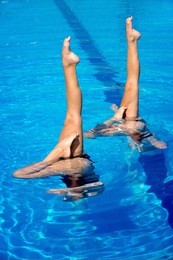 synchronized swimmers performance with legs outside water