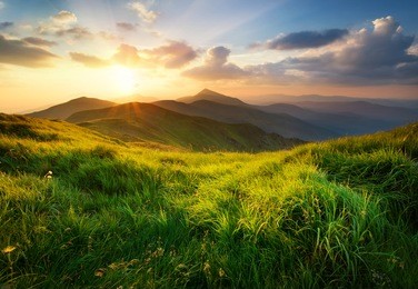 mountain valley during sunrise. natural summer landscape