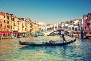 gondola near rialto bridge in venice, italy
