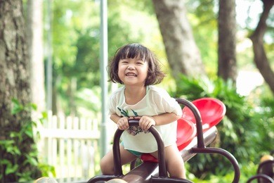kids playing at the see-saw in the playground