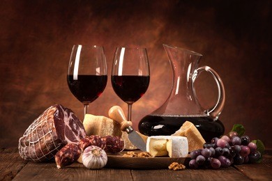romantic dinner with wine, cheese and traditional sausages