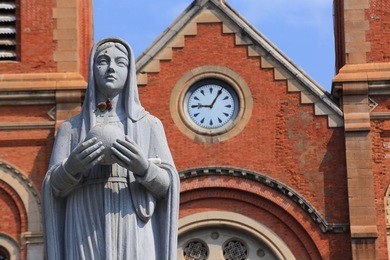  saigon notre-dame cathedral basilica on blue sky background. a popular tourist destination of asia.