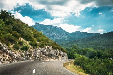 beautiful open asphalt mountain road under sunny blue sky. verdon gorge in france. french landscape