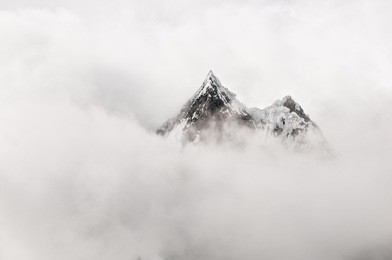 mountain top surrounded by clouds