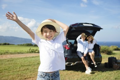 happy family with little girl travel by car