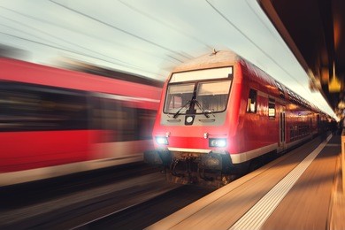 railway station with modern high-speed  passenger train in motion blur effect nuremberg, germany. railroad
