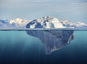 iceberg with above and underwater view taken in greenland